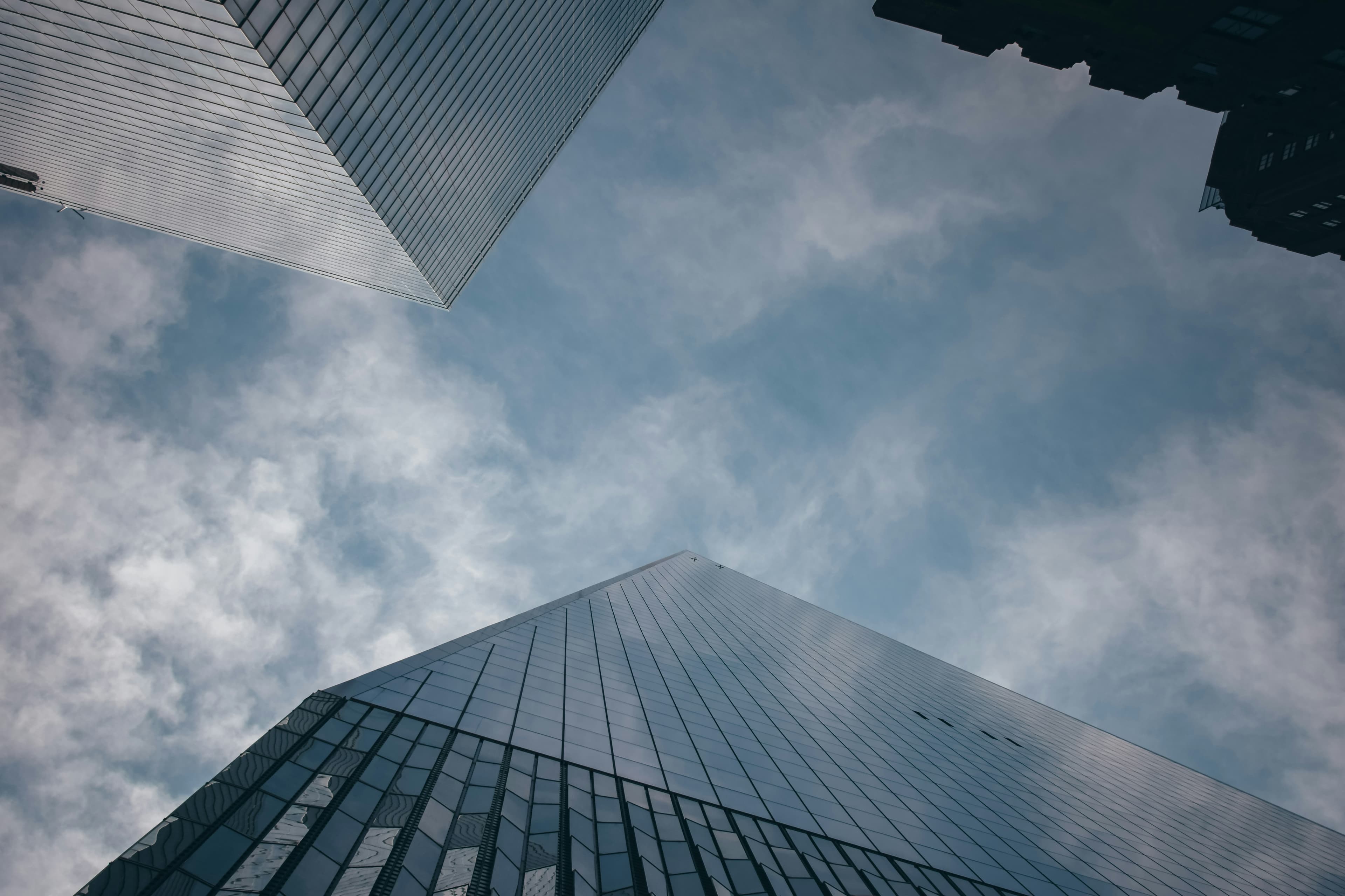 Lower Manhattan financial district, looking up between glass towers.