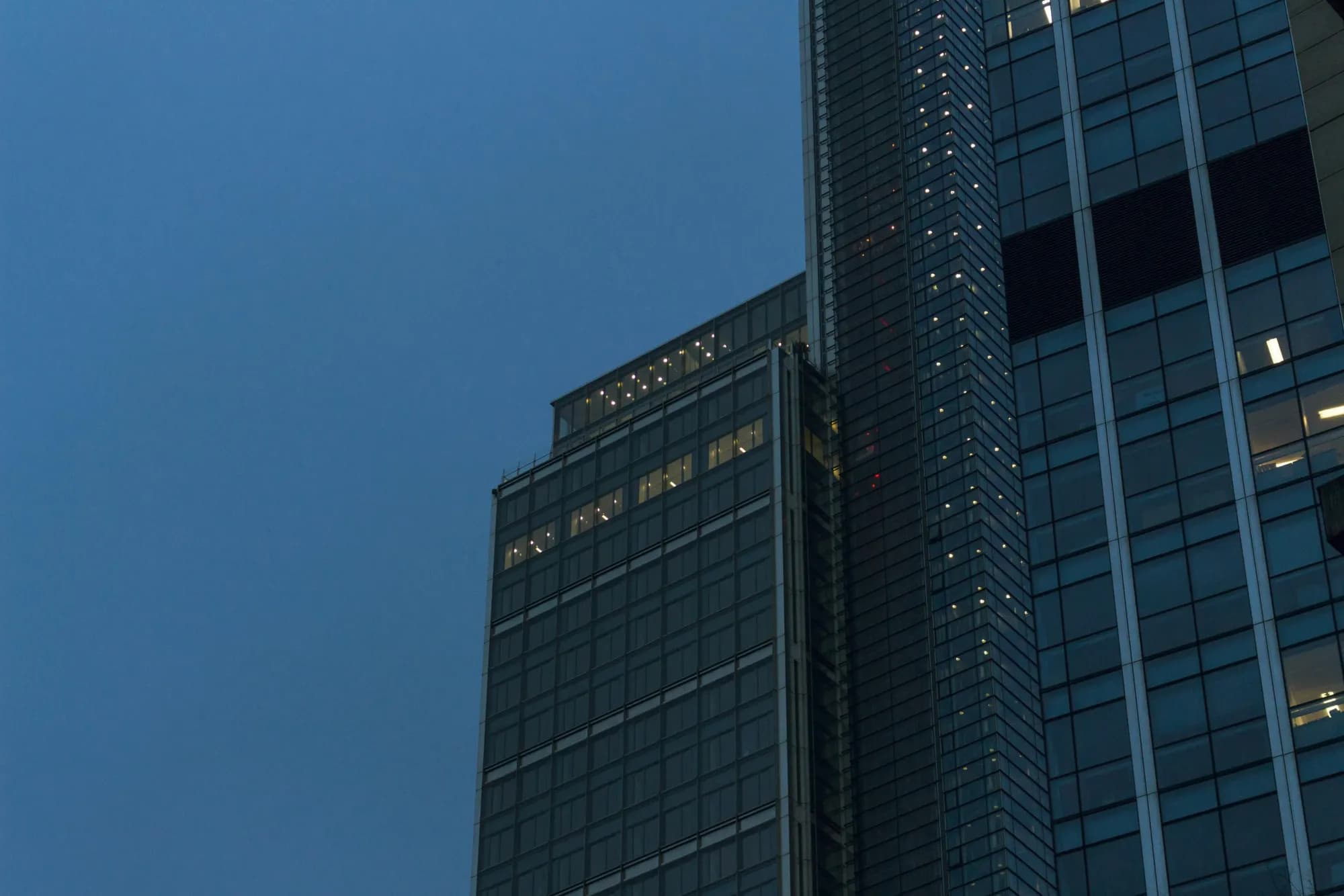 Glass office towers at dusk